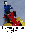 A broken arm on one of the vinyl men